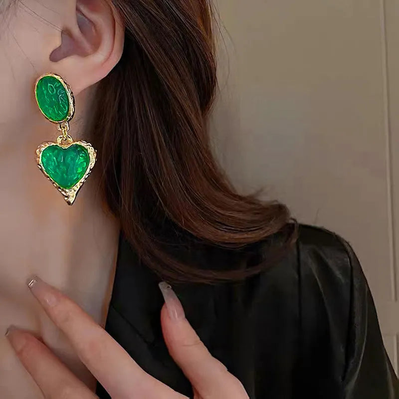 Silver needle pleated oval love heart stud earrings in purple, red, green, and yellow white colours.