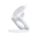 Foldable magnetic wireless car phone charger holder in white on car dashboard