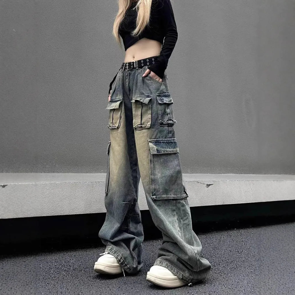 Light blue and black loose fit distressed denim pants with multiple tooling-style pockets