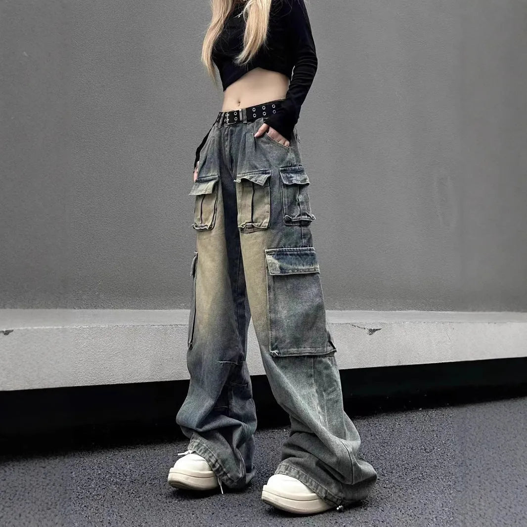 Light blue and black loose fit distressed denim pants with multiple tooling-style pockets