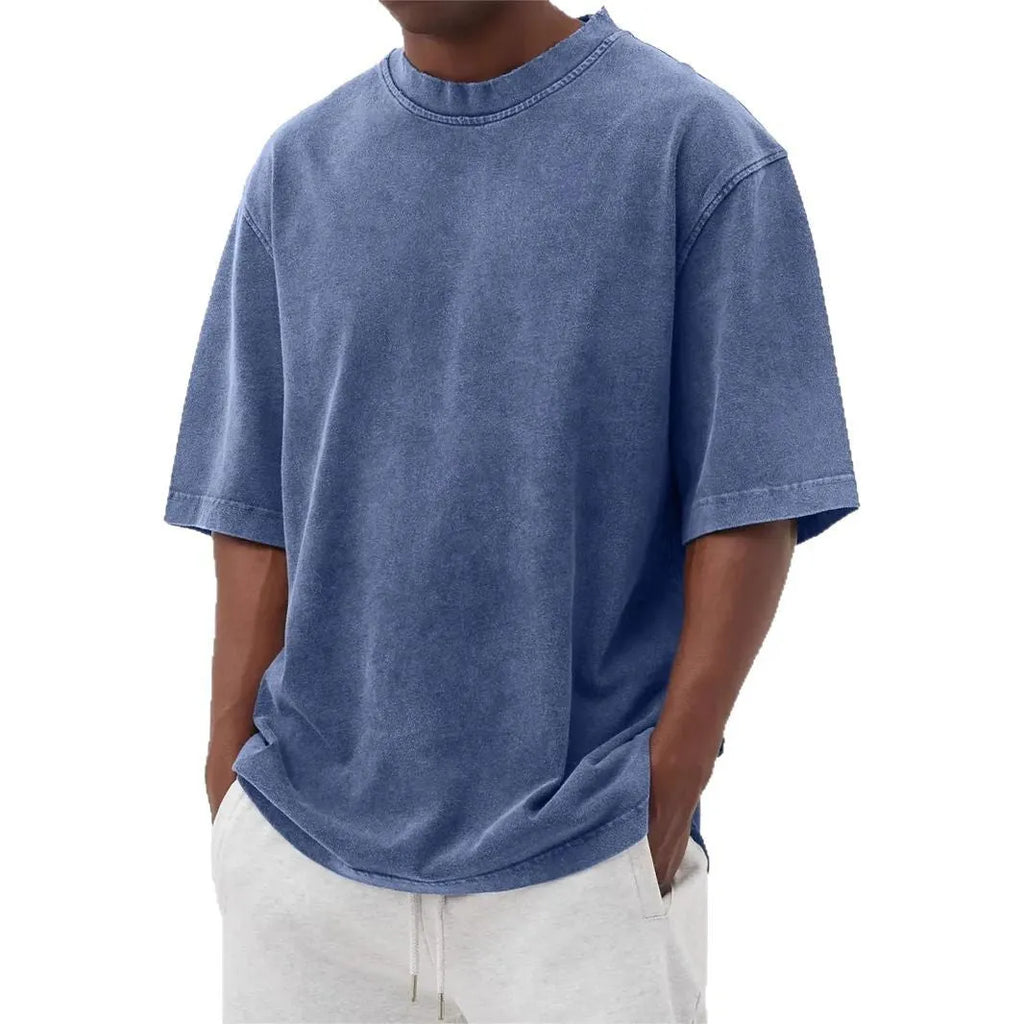 Men's loose fit stone washed polyester t-shirt in army green colour, showing distressed texture and short sleeves.