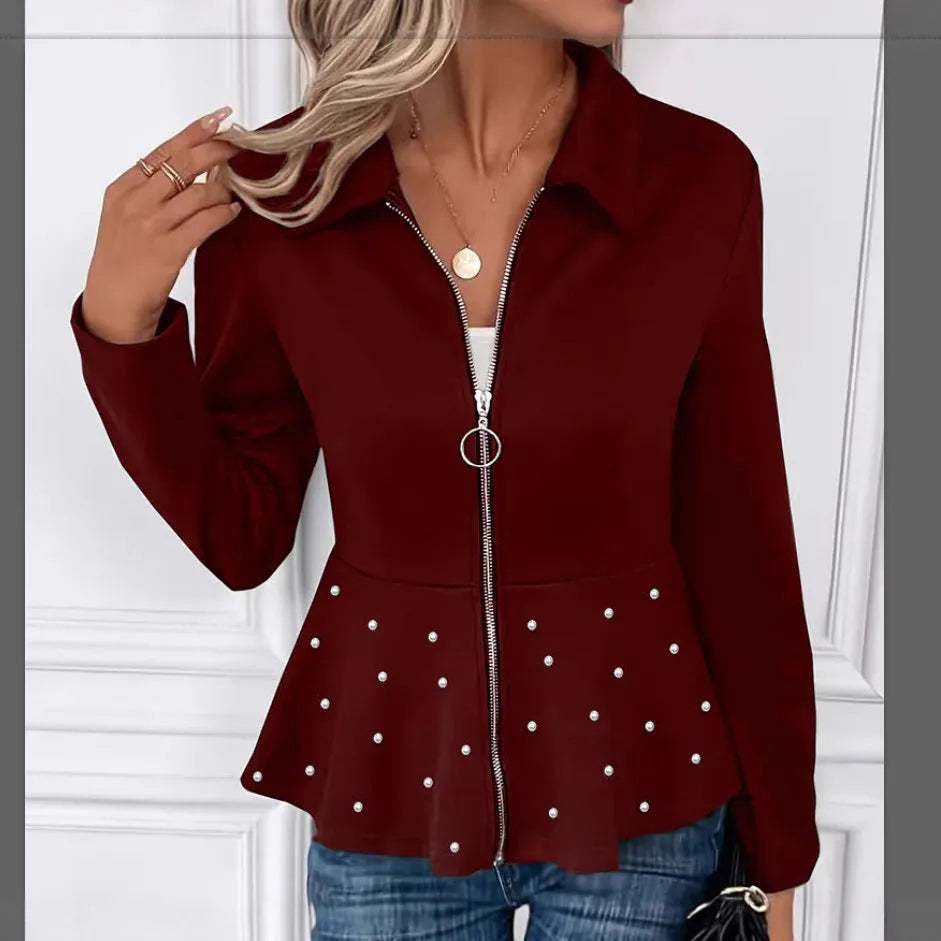 Women's black loose fit coat with beaded heavy-duty zipper and ruffled hem detail.