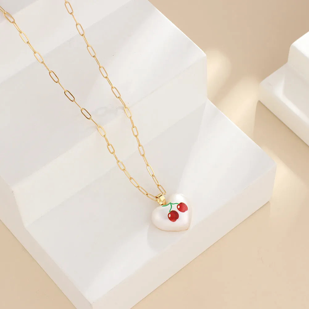 Geometric fruit pendant necklace with adjustable chain showing Apple, Cherry, Pear, Pineapple and Strawberry colour variations