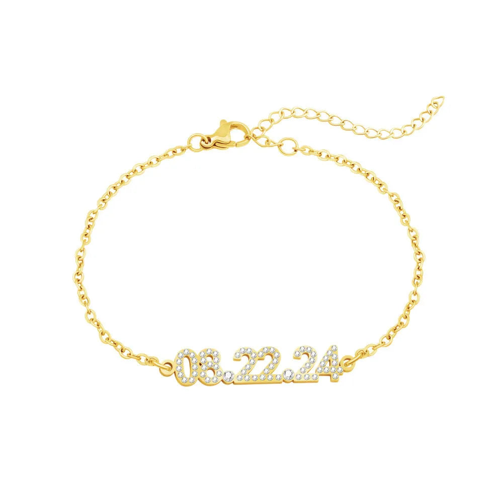 Stainless steel digital bracelet and necklace with diamond-set numbers in gold, rose gold, and steel finishes.