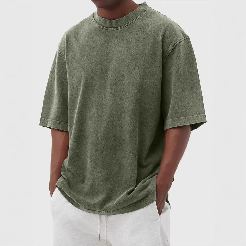 Men's loose fit stone washed polyester t-shirt in army green colour, showing distressed texture and short sleeves.