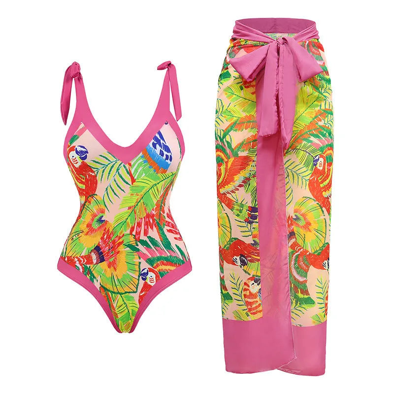 Retro pink floral print women's one-piece swimsuit with a V-neck, covered belly, and thin skirt.
