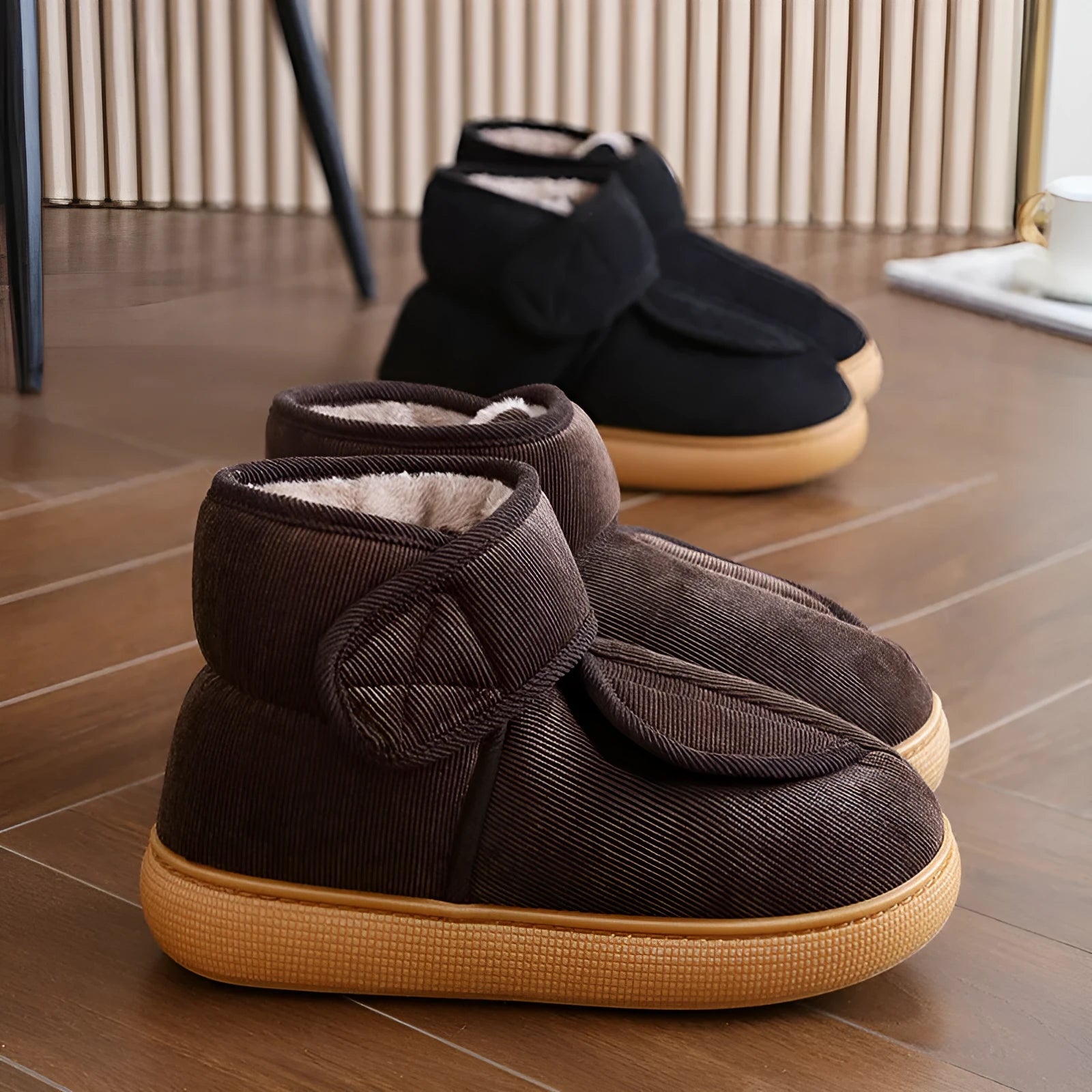 Large opening warm boots with anti-slip rubber soles, unisex slip-on design, plush upper and faux fur lining in black