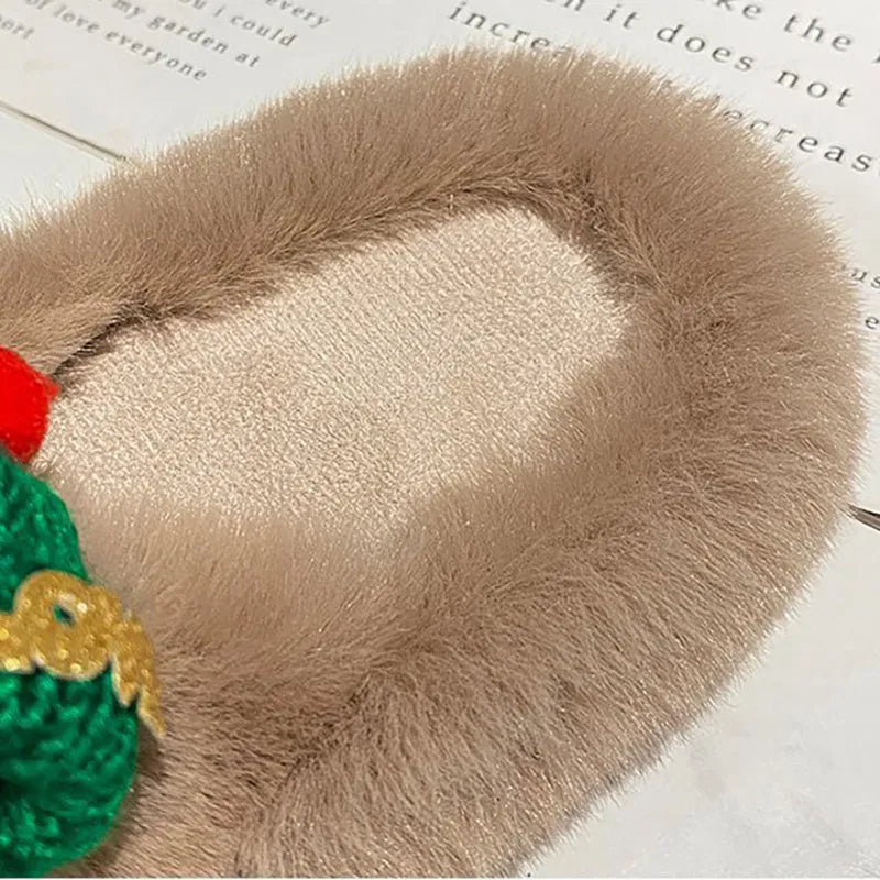 Women's Christmas slippers with a red and white hat decoration on the front, made from hairy plush fabric.