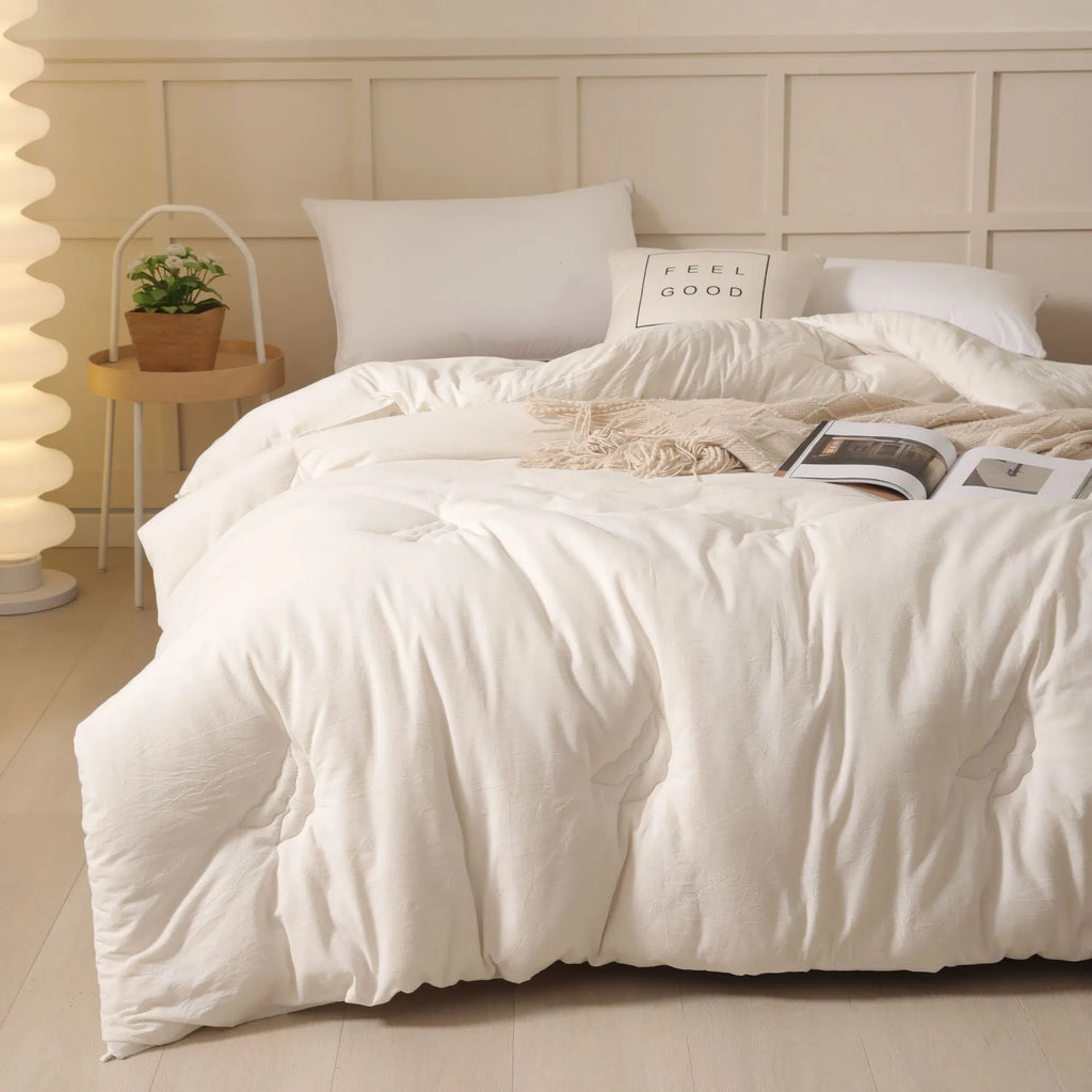 Soybean fibre pure cotton quilt shown in grey, pink jade or white colour on a bed.