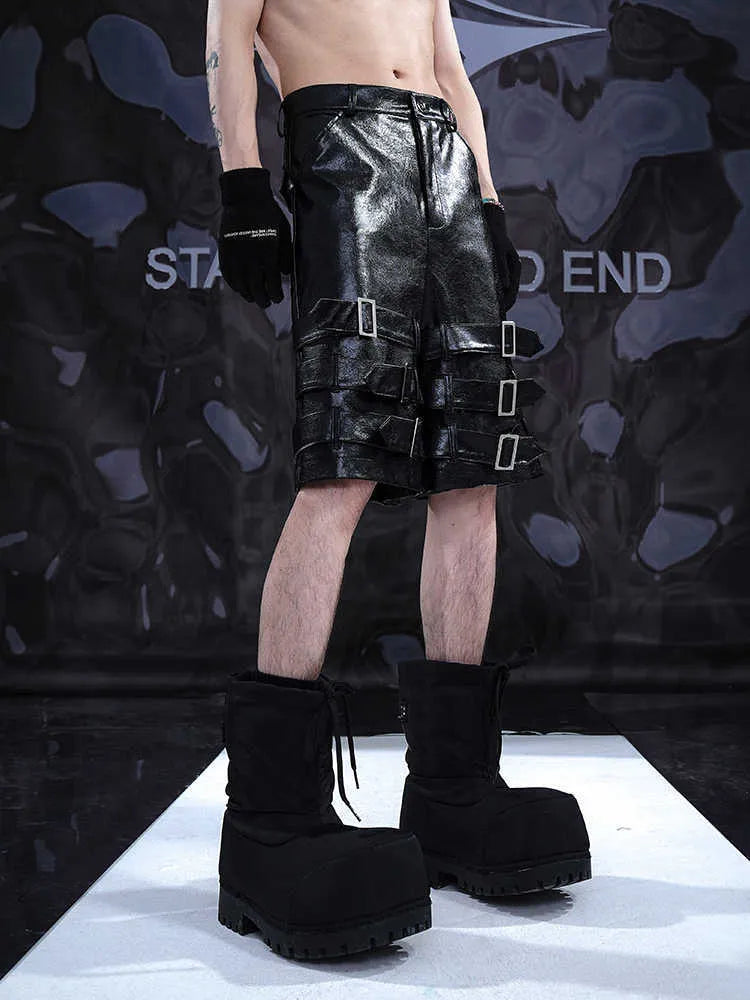 Men's black PU leather cropped shorts with leather ring detailing on leg