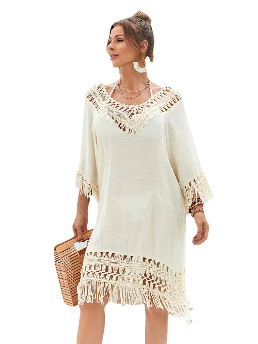 Apricot coloured hand-crocheted women's beach dress with a lining, shown on a model.