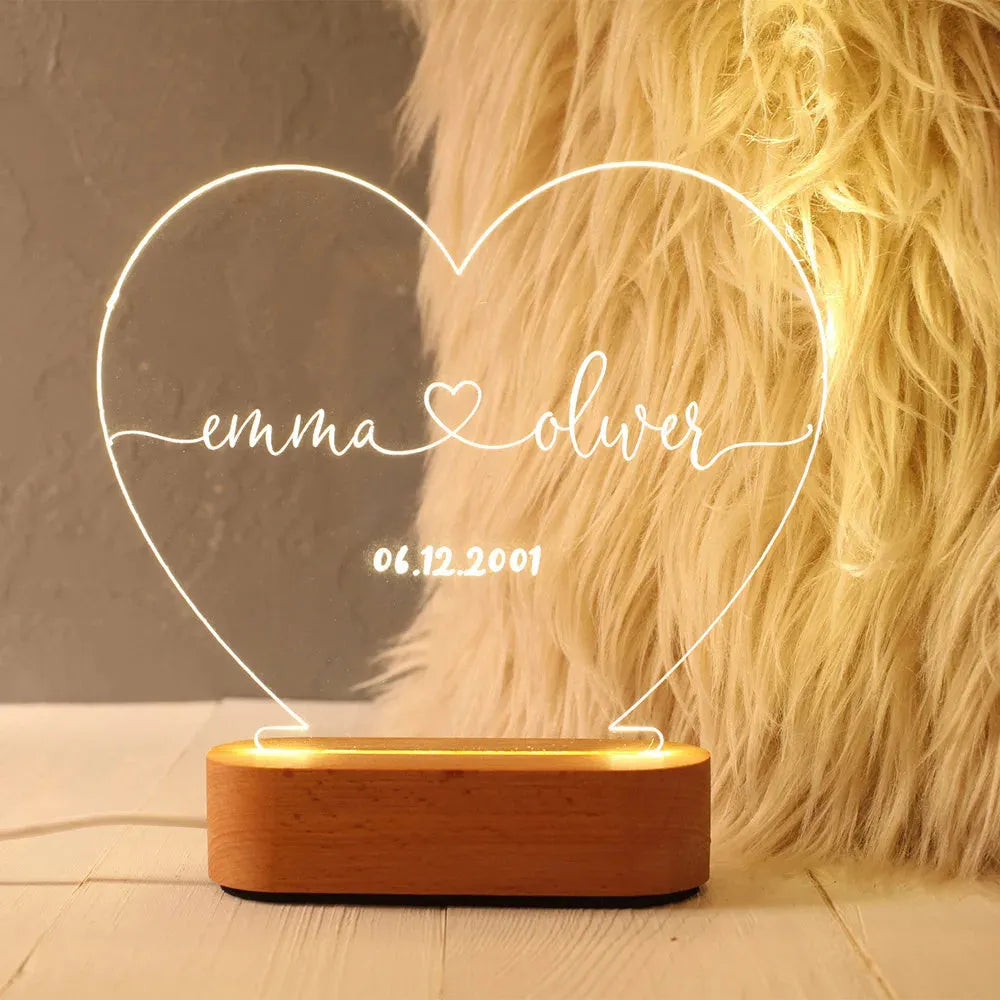 Custom acrylic night light with illuminated personalised names and dates for bedroom
