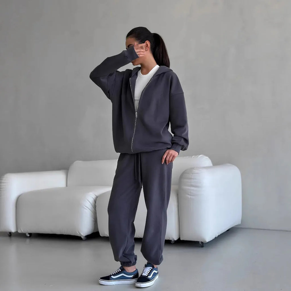 Street style loose fit two-piece set showing long-sleeved coat and matching trousers in solid colour