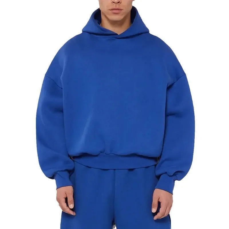 A man wearing a solid colour fleece-lined cotton hoodie with a wool lining.