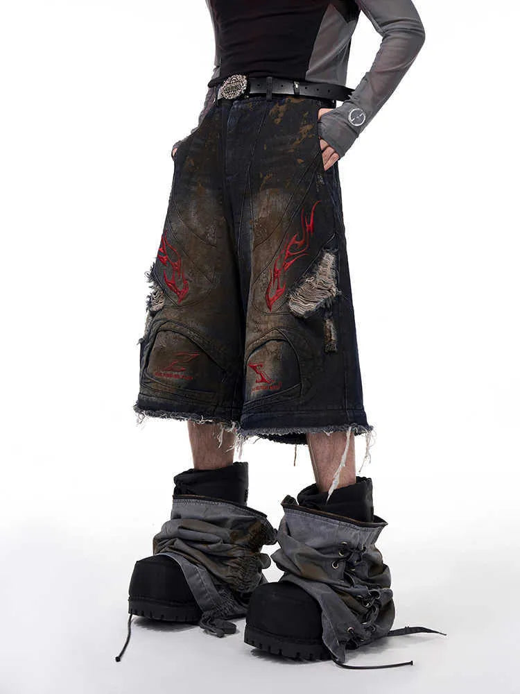 Men's retro-style denim jeans with detachable legs in a wide-leg, loose fit.