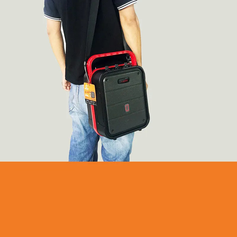 MS62AI portable Bluetooth speaker with wireless microphone, remote control, and charging cable.