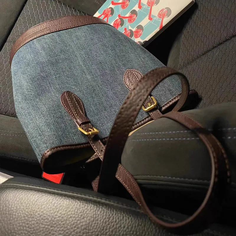 Denim patchwork handbag showing bucket shape with one-shoulder strap and patchwork detailing