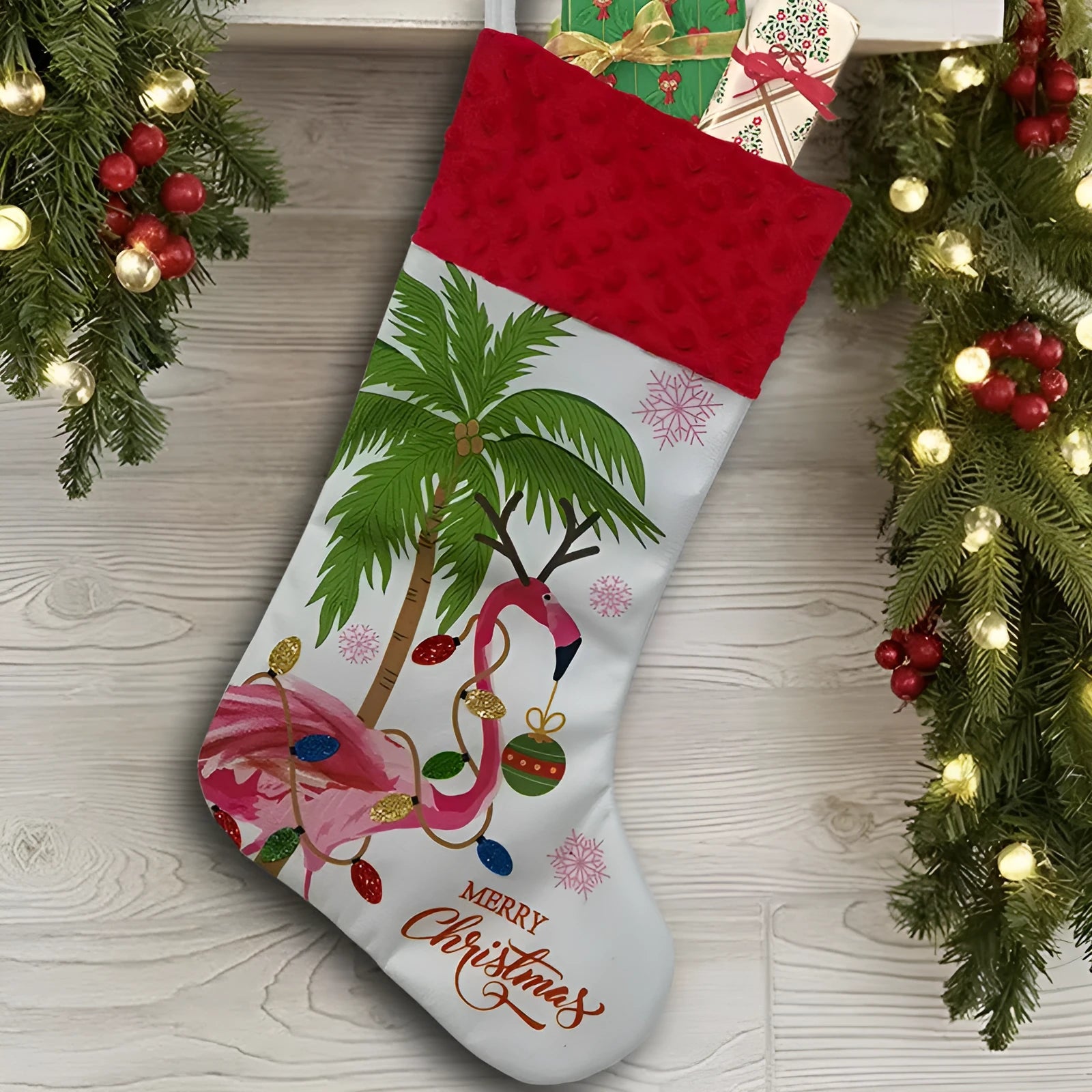 Flamingo patterned cloth Christmas stocking decoration measuring 46 by 28 centimetres.