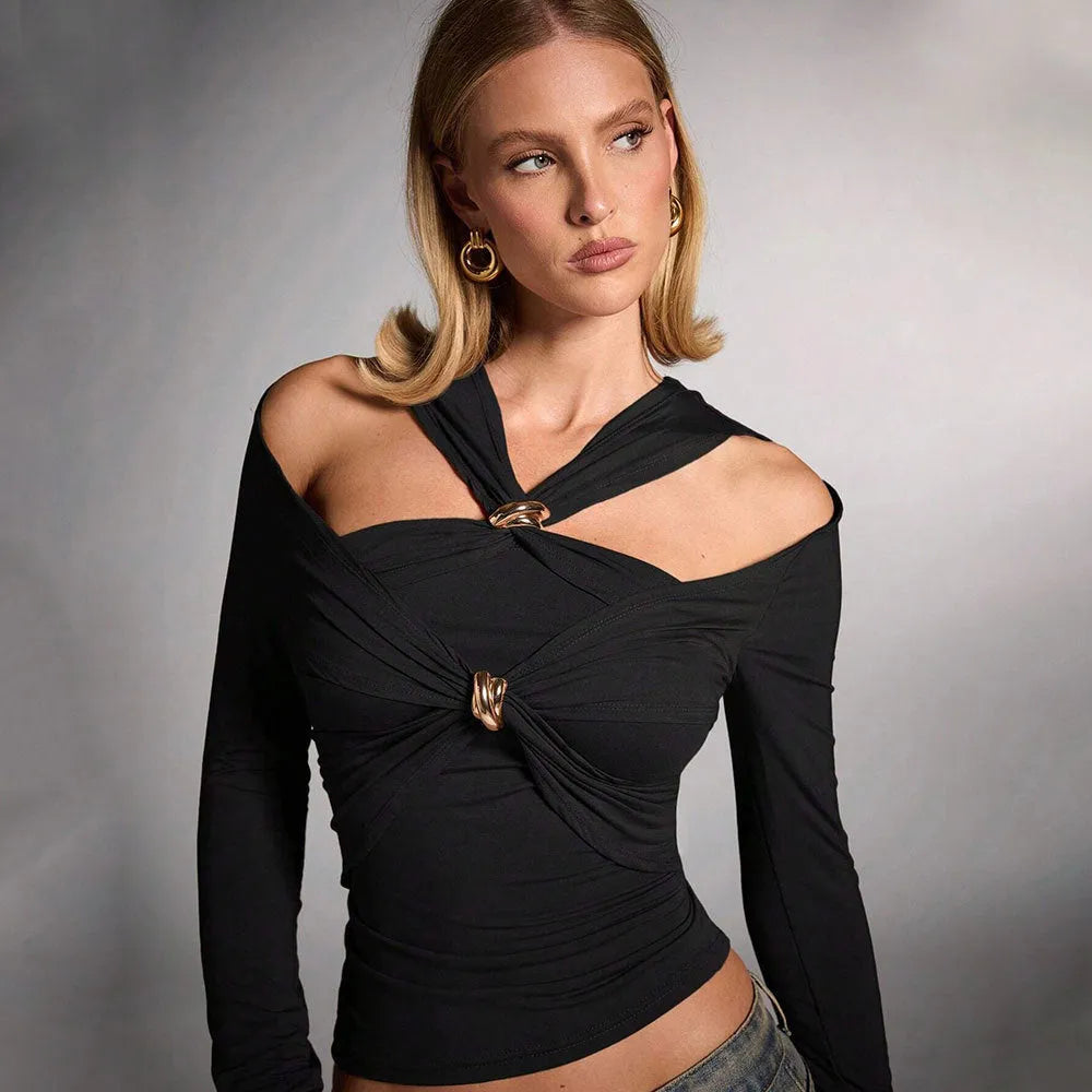 Black women's slim fit halter neck cropped top on a model, showing the sleeveless shoulder-baring design.