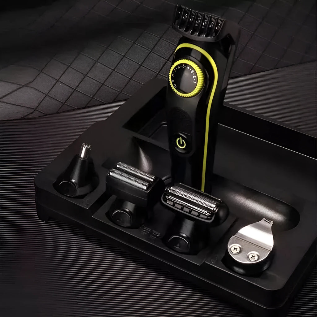 Black household electric hair clipper model KM-696 with USB cable and accessories on a plain background.