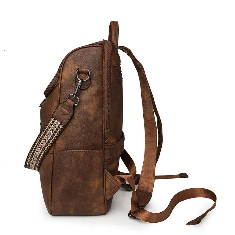 Retro college backpack with curved shoulder straps in six colour options including black, blue, and yellow apricot