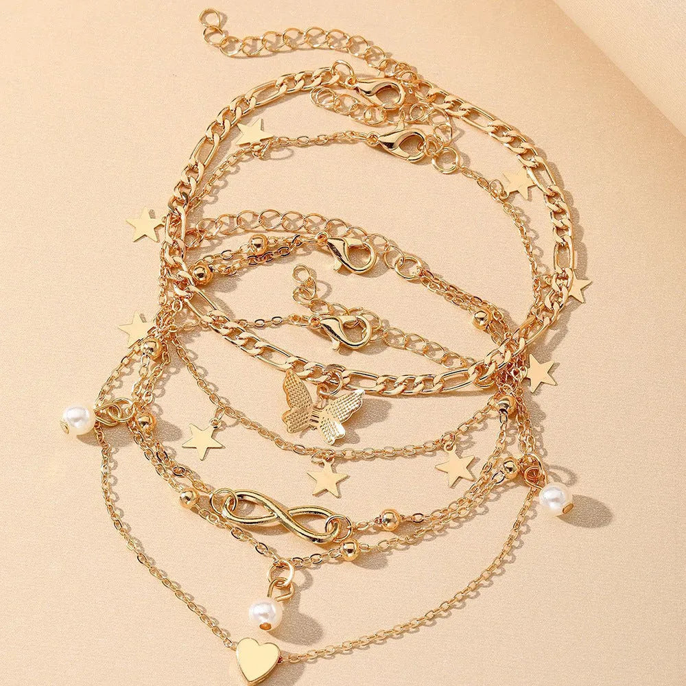 Butterfly Pearl Heart anklet 4-piece set showing layered women's ankle jewellery with charm details