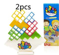 Plastic balance stacking game with 16 colourful building blocks, chassis and base on table
