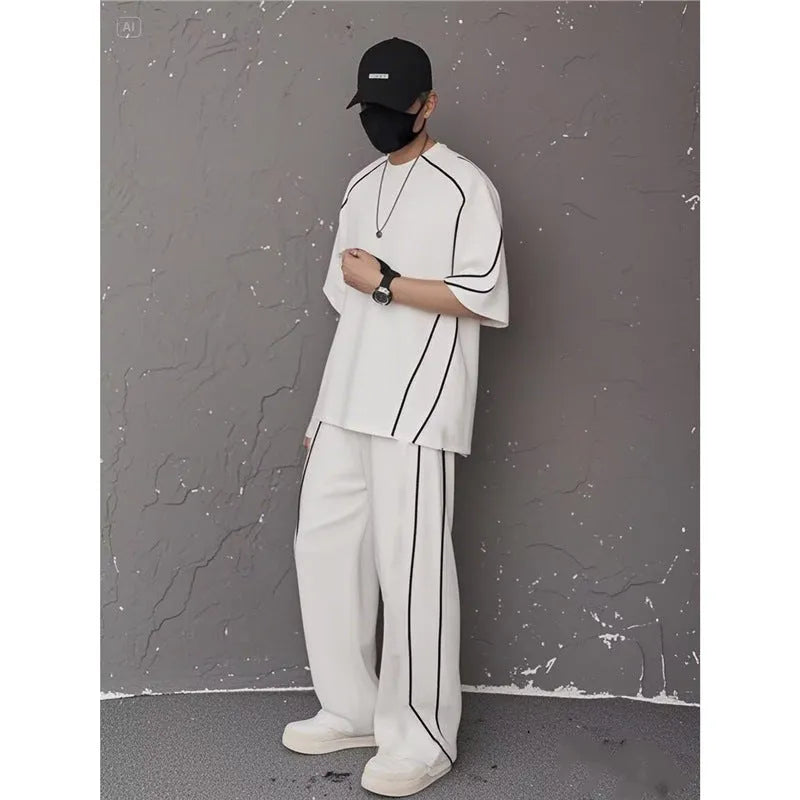 Summer women's sporty casual two-piece set in black suit with colour-blocking trim, short sleeve top and long pants