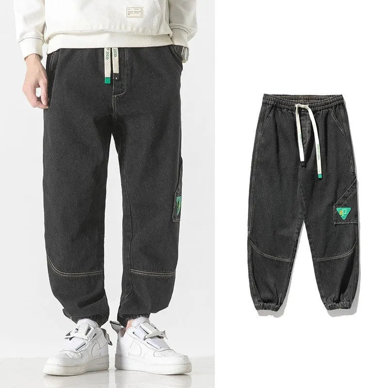 Men's loose-fit tapered trousers in black, available in sizes M through 8XL