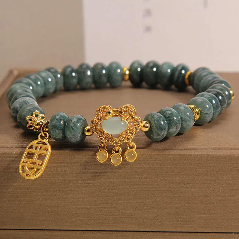 Women's natural emerald jade bracelet with alloy construction showing abacus bead design and safety lock closure