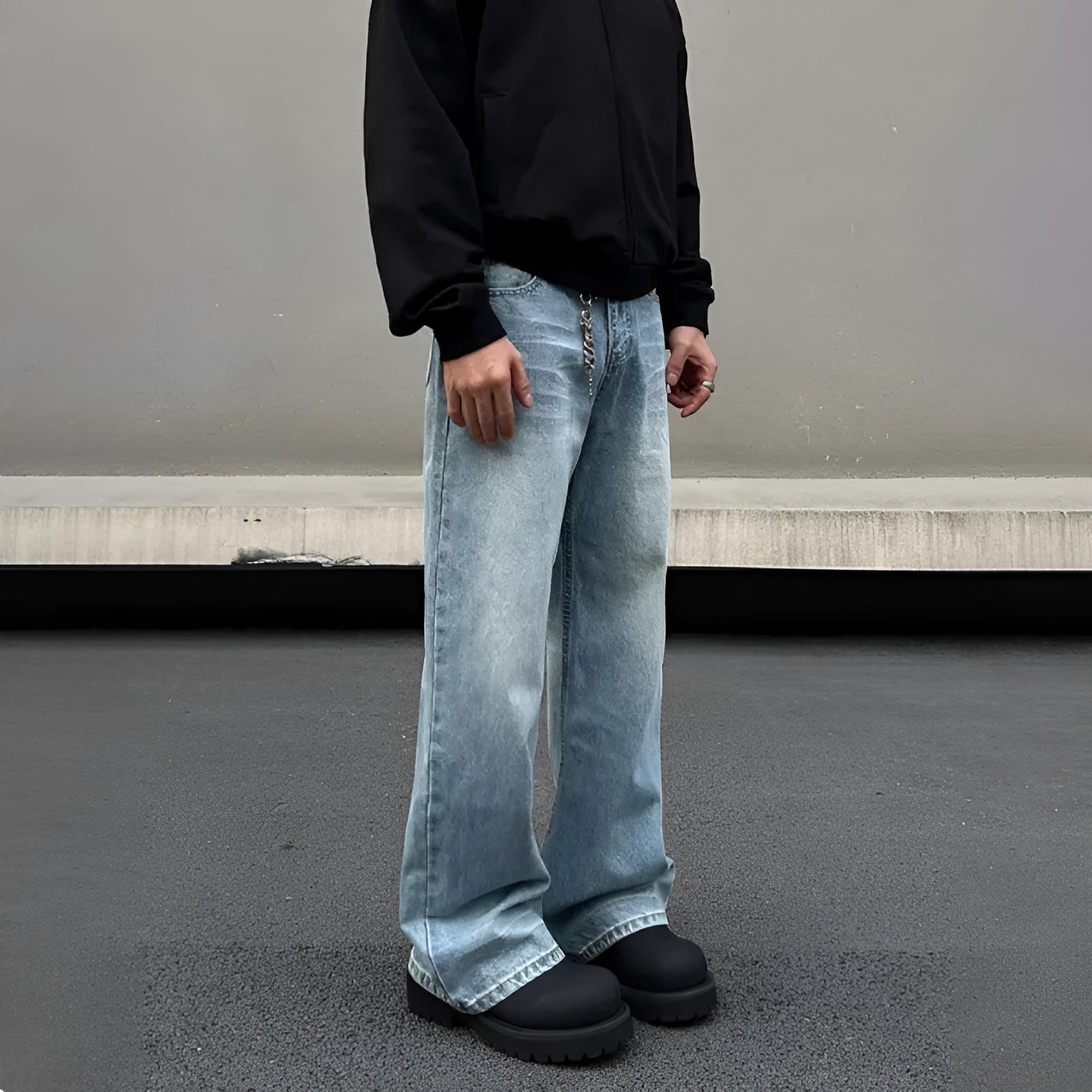 Men's blue straight leg jeans with a retro whisker wash, showing flared leg and visible stitching.