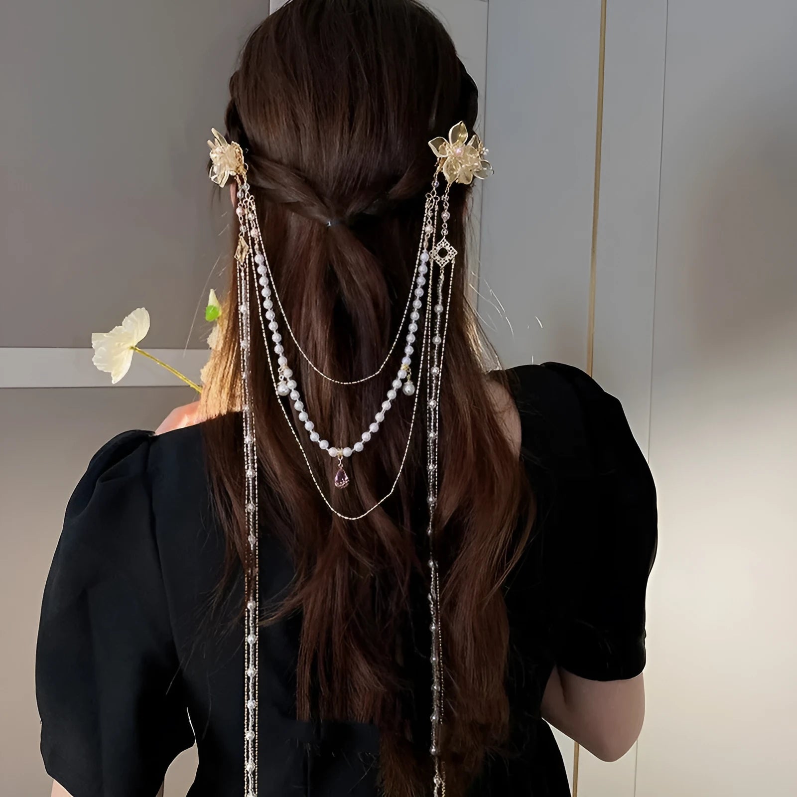 Gold women's hairpin with pearl, diamond and flower design featuring long tassel decoration