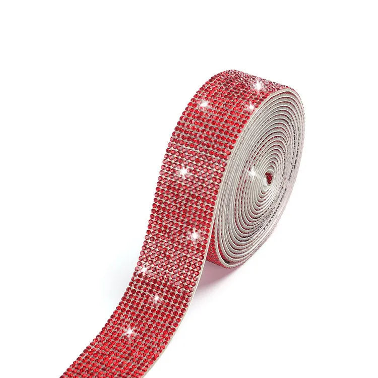 A 1 yard long strip of self-adhesive glass water drills in white and AB colour for clothing decoration