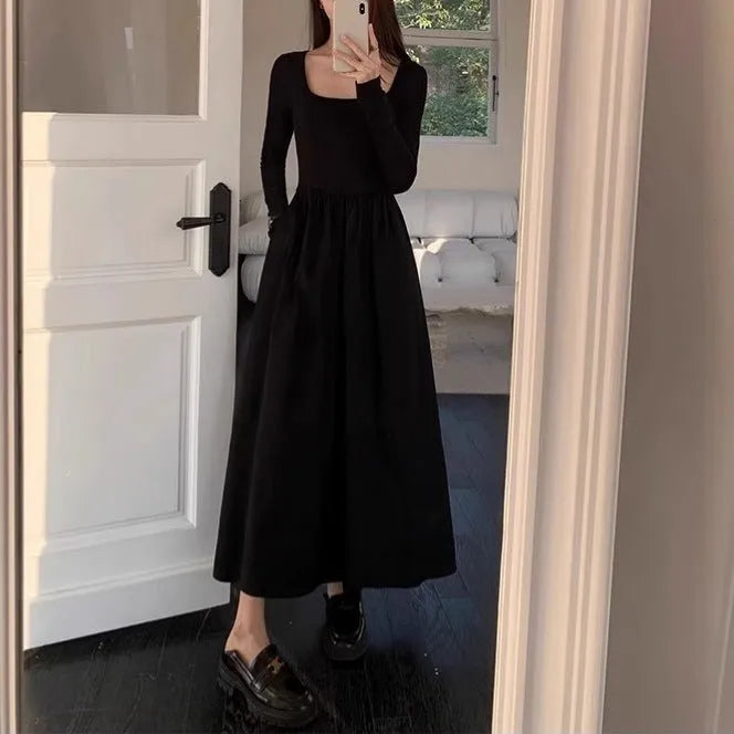 Women's black square collar A-line knitted dress with long sleeves and elastic waist.