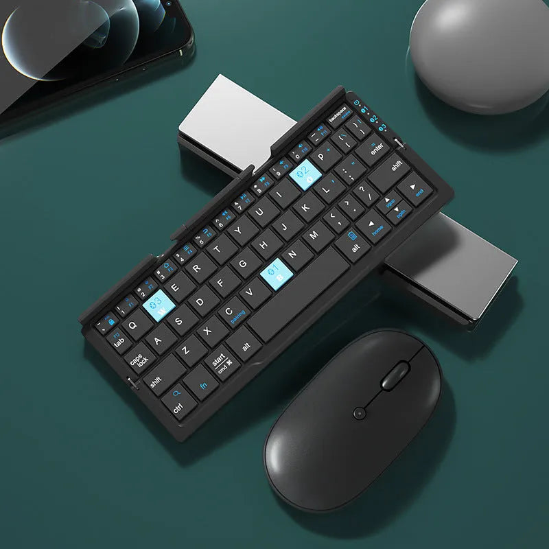 Silver white folding Bluetooth keyboard with built-in stand holding a tablet