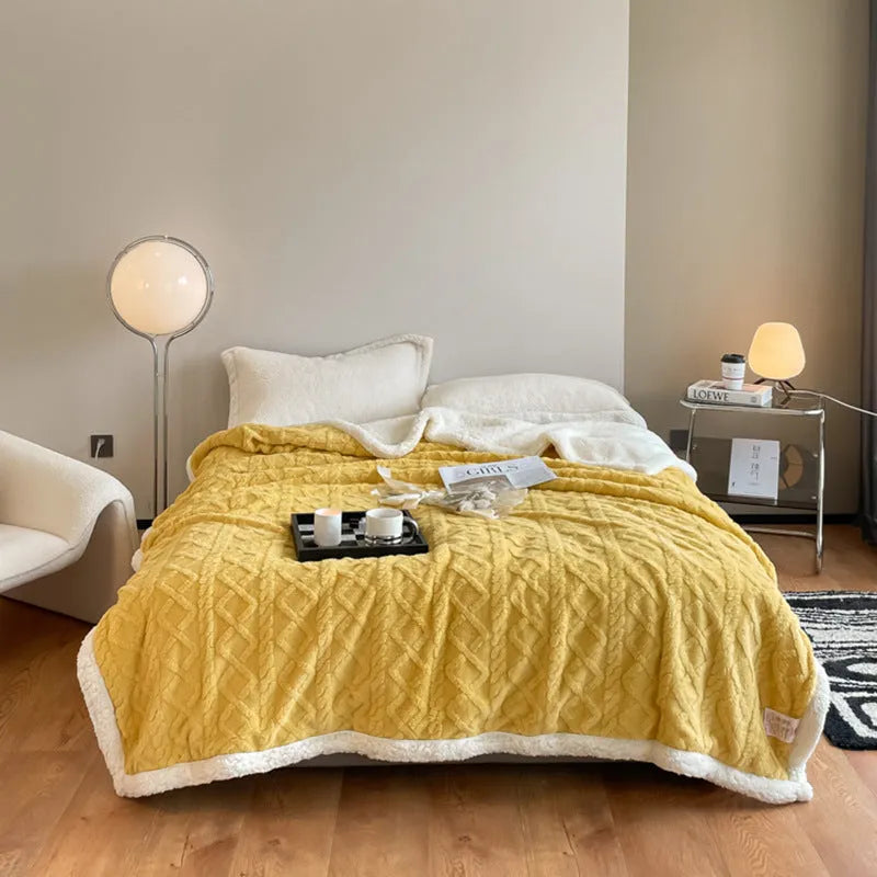 Polyester thermal flannel blanket in beige colour, folded to show texture, for winter bed use.