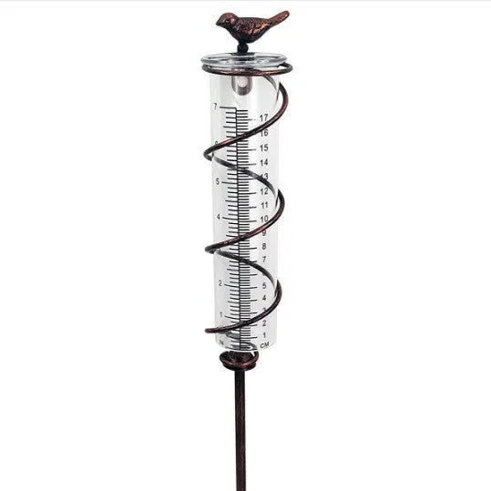 Cast iron hummingbird decoration garden rain gauge with glass measurement tube showing 1-20 scale