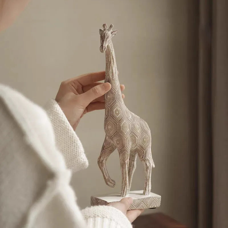 European style wood colour resin giraffe decorative ornament on a surface.