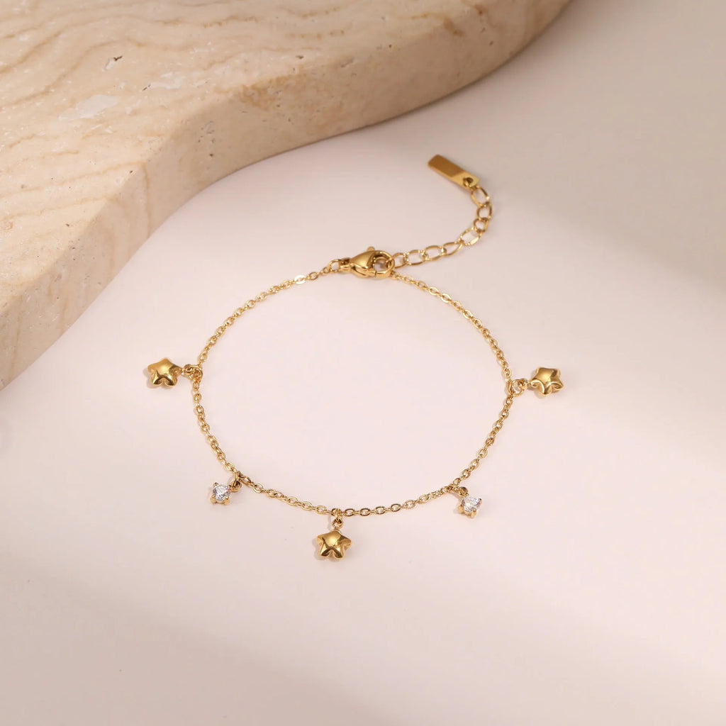 Ins women's stainless steel bracelet with 18K gold plating and a geometric star-shaped pendant.