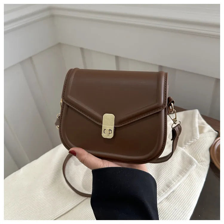 Soft, textured PU clamshell messenger bag in a horizontal rectangle shape.