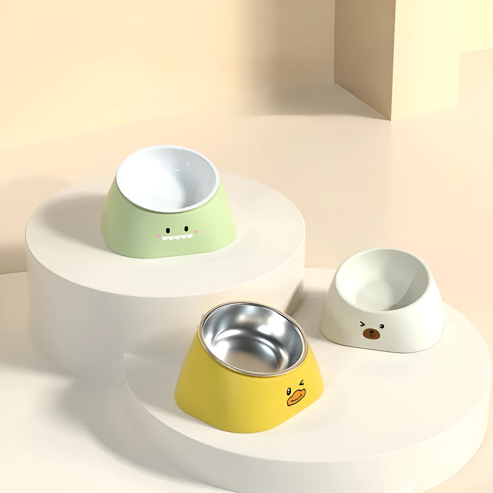 Green tilted pet feeding bowl with stainless steel insert and plastic base for cats and dogs.