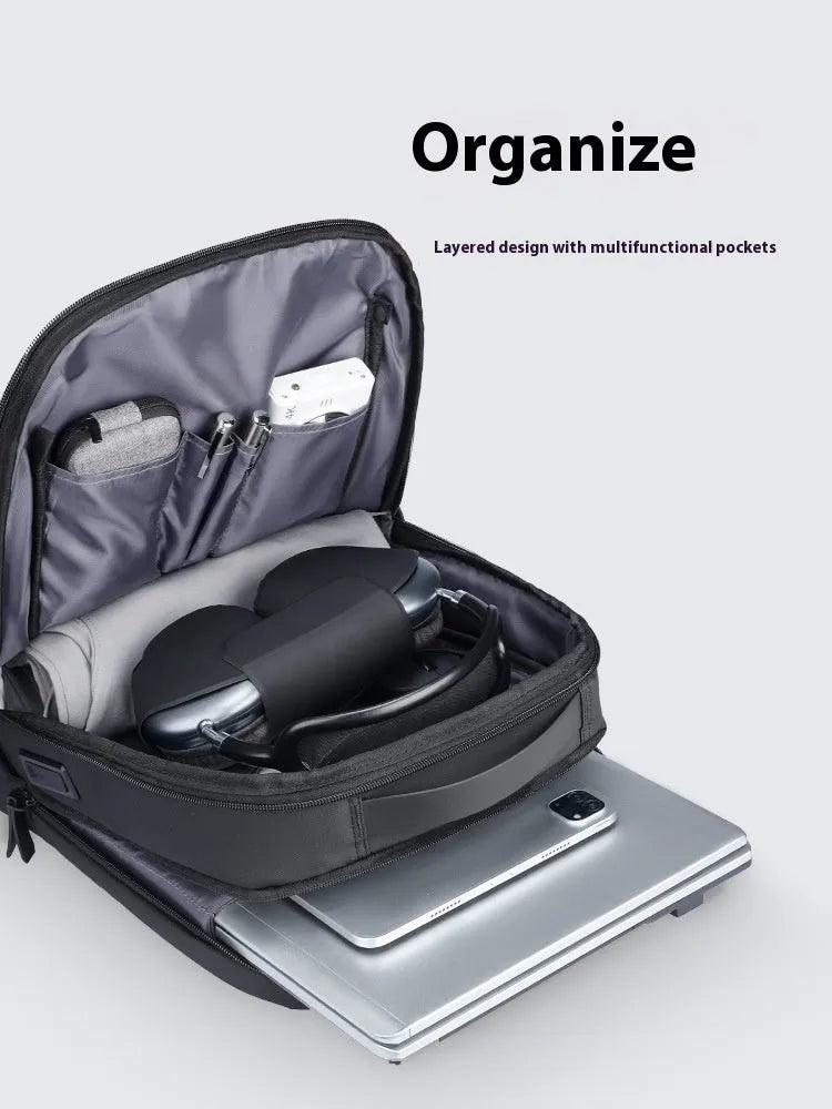 Graphite grey Oxford cloth business backpack with external USB charging port.