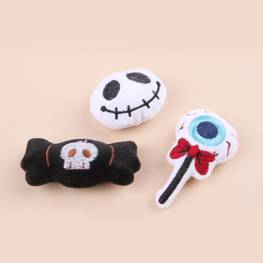 Small plush cat teaser toy with colourful candy or skull design on string