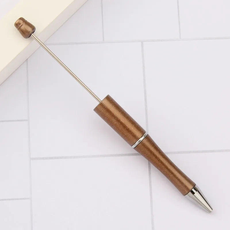 Spinning plastic beaded ballpoint pen in gradient colours showing ABS plastic construction