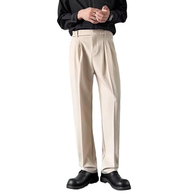 Man wearing apricot coloured straight-leg loose-fit suit pants made from polyester fibre.