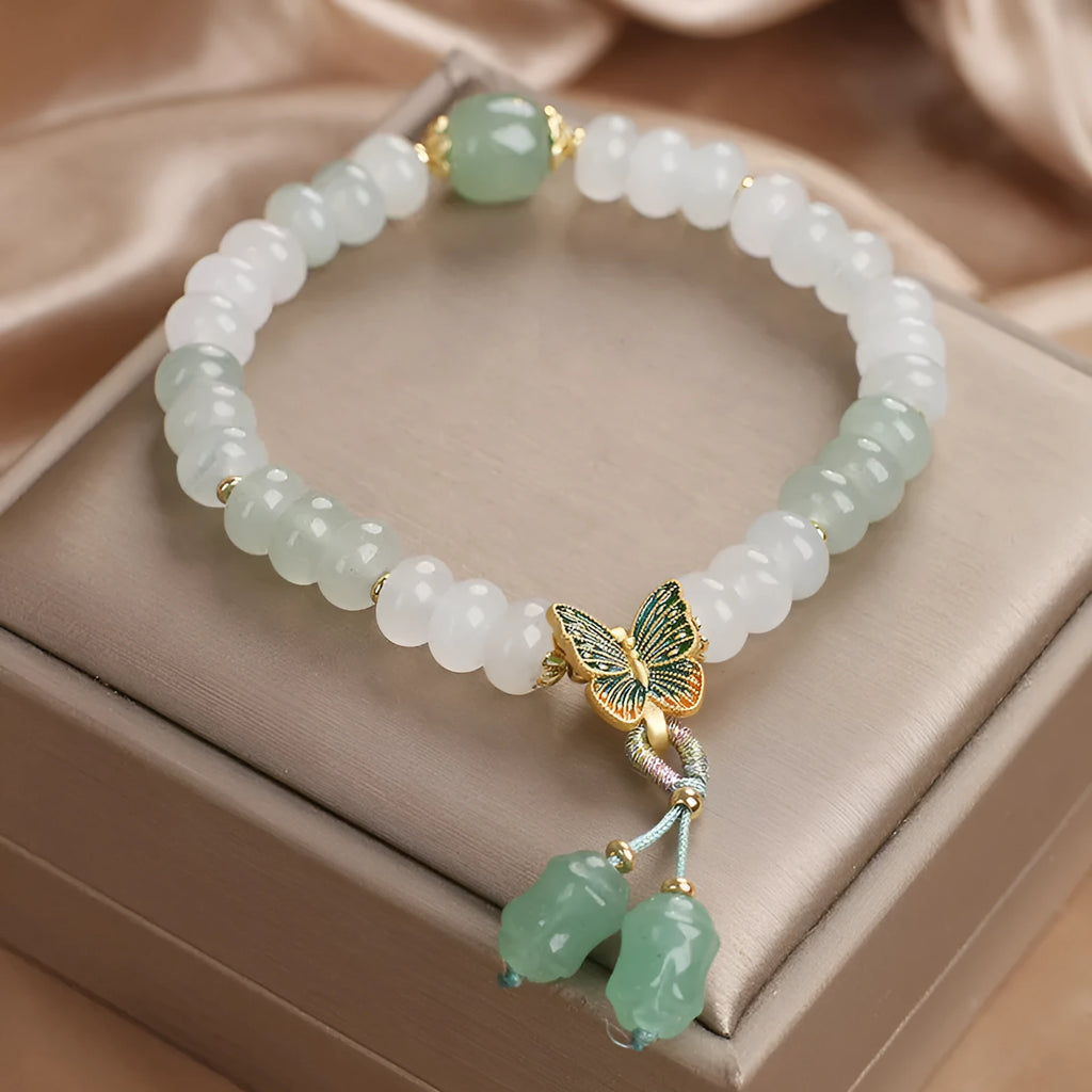 Green Tian Shan Cui abacus bead bracelet with retro butterfly tassel and pearl accents
