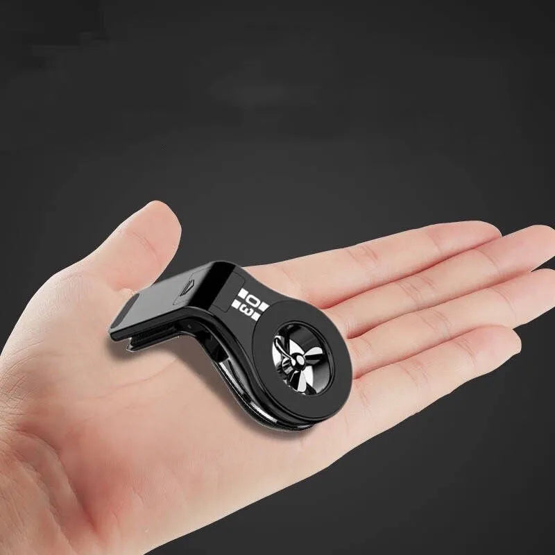 Magnetic car phone holder mounted on air vent with smartphone attached and perfume slices