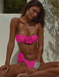 Black striped bikini set with flower detail tube top and split shorts on a mannequin.