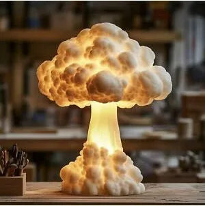Modern art atomic bomb explosion mushroom cloud shaped table lamp on a desk.