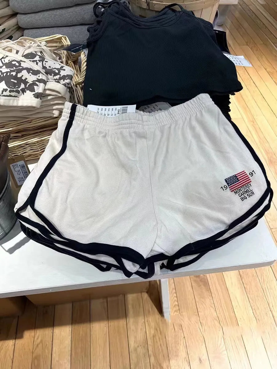 Women's cotton sports shorts with white flag embroidery in dark blue colour